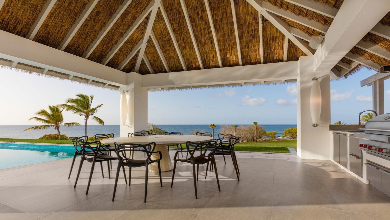 Thatched-roof oceanfront dining pavilion