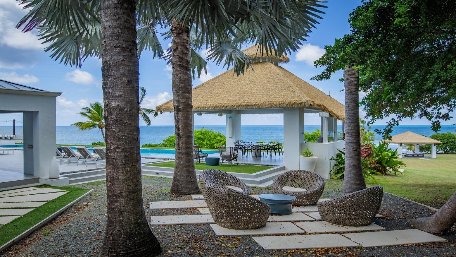Palm-shaded outdoor lounge