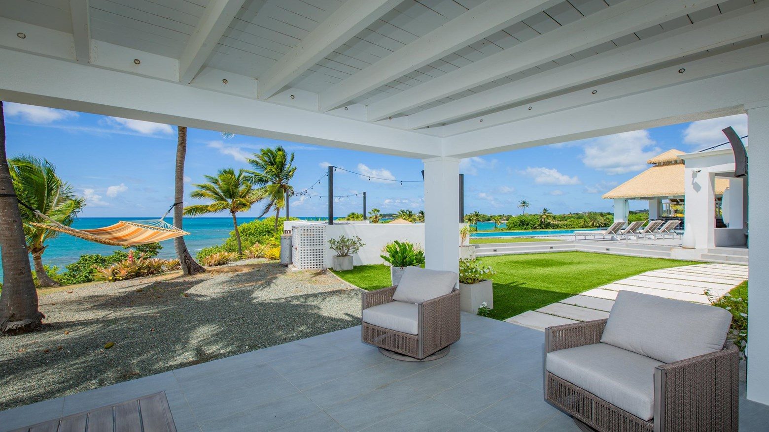 Covered patio with hammock and ocean view