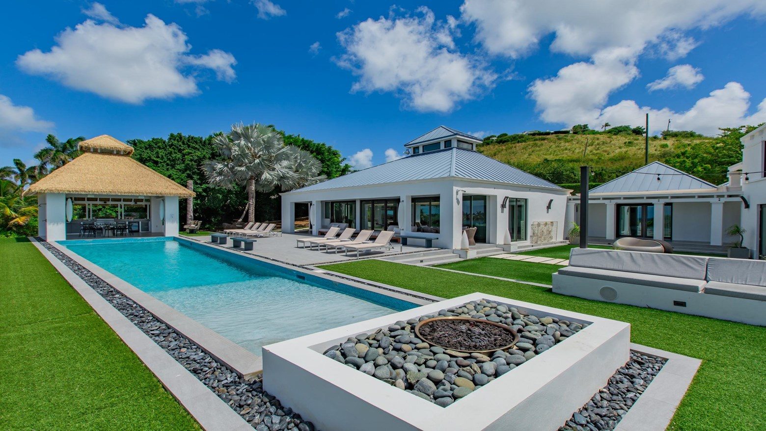 Pool deck and cabana by day